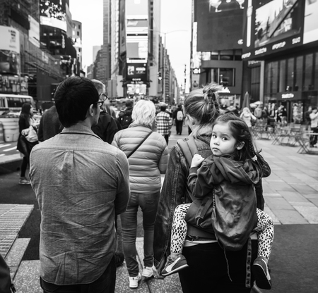 NEW YORK, USA - May 03, 2016: Black and white image of Manhattan street scene. New Yorkers and tourists walking on Times Square in New York Cityのeditorial素材