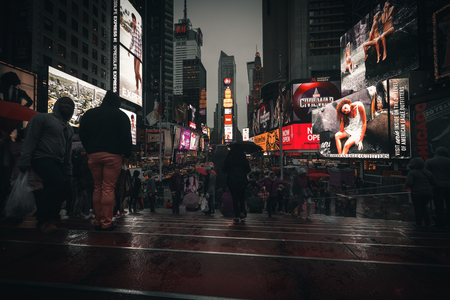 NEW YORK, USA - Apr 30, 2016: Times Square in the rainy evening. Brightly adorned with billboards and advertisements, Times Square is sometimes referred to as The Crossroads and The Heart of the Worldのeditorial素材