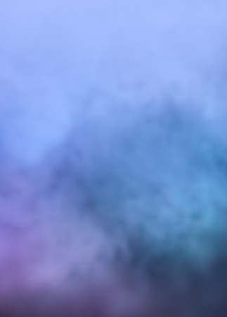 Defocused blurred image of colorful smoke on dark background. Texture and abstract artの写真素材