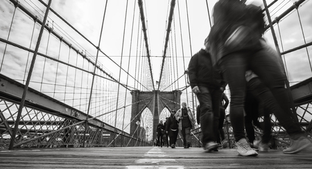 NEW YORK, USA - Apr 29, 2016: NYC street scene. New Yorkers and tourists walking on the Brooklyn...