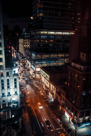NEW YORK, USA - Sep 27, 2015: Streets of Manhattan at night. Manhattan is the most densely populated of the five boroughs of New York Cityのeditorial素材