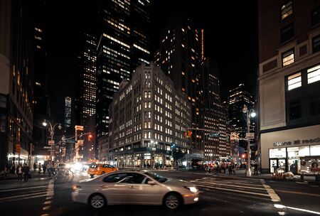 NEW YORK, USA - Sep 29, 2015: Streets of Manhattan at night. Manhattan is the most densely populated...