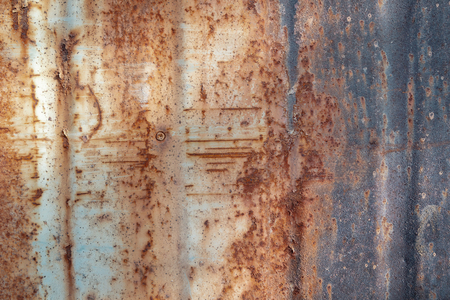 Texture of the old paint on rusty metal wall