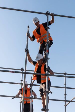 KYIV, UKRAINE - May 03, 2017: Worker prepares billboard to installing new advertisement on the Independence Square in Kyivのeditorial素材