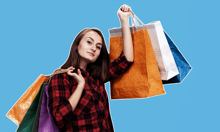 Ð¡ommerce and shopping season. Happy young woman with shoping bags. Magazine style collage with copy spaceの写真素材