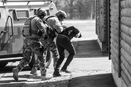 CHERKASY Reg, UKRAINE - May 03, 2019: Demonstrative performances by border guards on the territory of the Main Personnel Training Center of the State Border Service of Ukraine. Detention of a criminalのeditorial素材