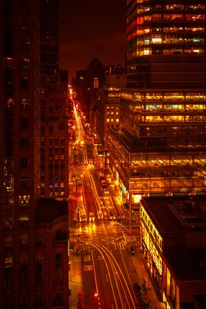 NEW YORK, USA - Sep 29, 2015: Streets of Manhattan at night. Manhattan is the most densely populated...