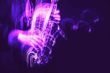 Jazz music concept. Abstract motion blurred image of saxophone player performing on stage. Sax player going crazy.の写真素材