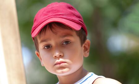 Portrait of a 3-4 years boy playing on the playgroundの写真素材