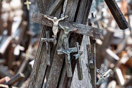 Crucifixion of Christ and a large number of crosses at Hill of Crosses. Hill of Crosses is a unique monument of history and religious folk art in Siauliai, Lithuania.の写真素材