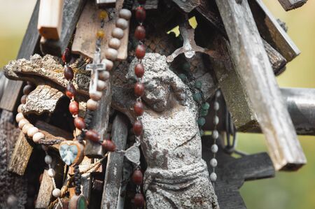 Crucifixion of Christ and a large number of crosses at Hill of Crosses. Hill of Crosses is a unique...