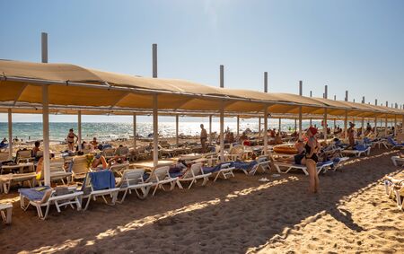 Belek,  Turkey - Aug. 08, 2019: Vacationers on the beach near the sea. Vacation and happy life style concept. Summer holidays backgroundのeditorial素材