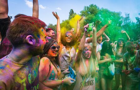 KIEV, UKRAINE - Jun 25, 2016: Holi colors holiday. Crazy crowd of young people having fun during...