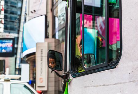 NEW YORK, USA - Apr 27, 2016: Manhattan street scene. New York and New Yorkers. A bus on the streets...