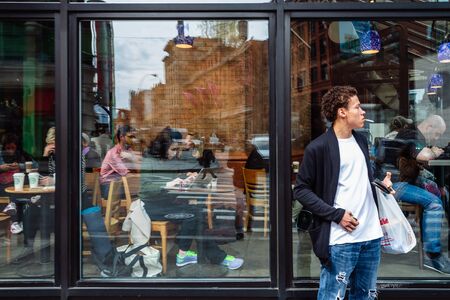 NEW YORK, USA - Apr 28, 2016: Manhattan street scene. The Americans on the streets of New York....