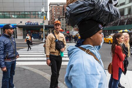 NEW YORK, USA - Apr 28, 2016: Manhattan street scene. The Americans on the streets of New York....