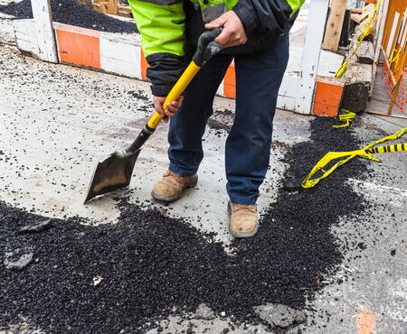 NEW YORK, USA - Apr 28, 2016: Manhattan street scene. Road works in Manhattan, New York City. Workers on a road construction, repairing the roadのeditorial素材