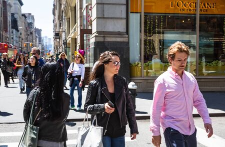 NEW YORK, USA - Apr 30, 2016: Manhattan street scene. The Americans on the streets of New York City