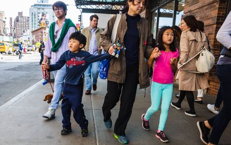 NEW YORK, USA - Apr 30, 2016: Manhattan street scene. The Americans on the streets of New York City....