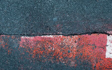 Abstract composition on the asphalt. Abstract sign on asphalt background. Texture of asphalt road with spots and pattern of old cracked asphalt surface close upの写真素材