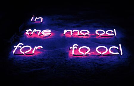 In the mood for food neon sign on a concrete grunge wall