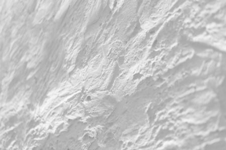 Texture of decorative plaster on concrete wall in light gray. Abstract plaster background for design