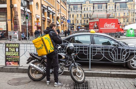 Kyiv, Ukraine - Nov. 16, 2019: A Glovo food delivery courier delivers food in Kyiv, Ukraine.