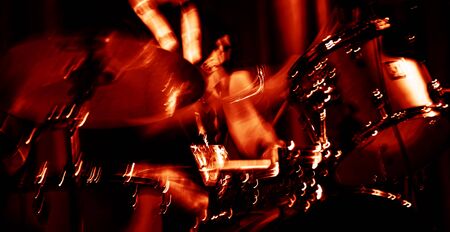 Musician with drums. Abstract image of a drummer at concert. Intentional motion blur and trendy lava...