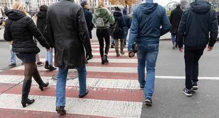 Kyiv, Ukraine - Nov 16, 2019: Young people at a pedestrian crossing on Khreshchatyk street in Kievのeditorial素材
