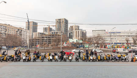 Kyiv, Ukraine - Mar. 20, 2020: A Glovo food delivery couriers delivers food in Kyiv, Ukraine