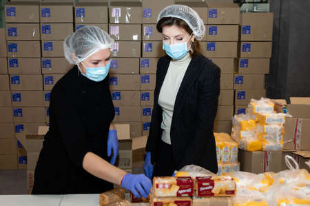 Kyiv, Ukraine - Mar. 27, 2020: Coronavirus epidemic in Ukraine and help to the poor. 3 thousand food...