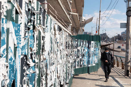 Kyiv, Ukraine - Mar. 27, 2020: Kyiv streets during the coronavirus epidemic. People in protective medical masks.のeditorial素材