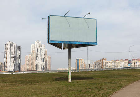 Kyiv, Ukraine - Mar. 24, 2020: Blank billboard and new buildings on Poznyaki residential area in Darnitskiy district of Kyiv, Ukraineのeditorial素材