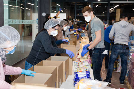 KYIV, UKRAINE - Apr. 04, 2020: Coronavirus epidemic in Ukraine and help to the poor. Thousands food packages from the Poroshenko Foundation sent to pensioners and people with disabilitiesのeditorial素材