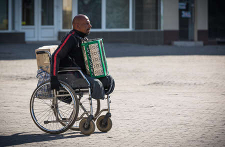 Uzhgorod, Ukraine - Apr. 10, 2020: People on the street rush about their business during the...