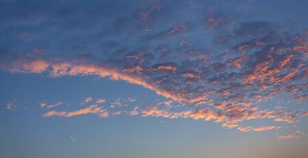 Natural background. Twilight beautiful sky. Twilight colorful sky and cloud with sunlight shine behind backgroundの写真素材