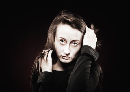 Teenage girl portrait with hands near the face. Fashion, portrait and people concept. Portrait of a...