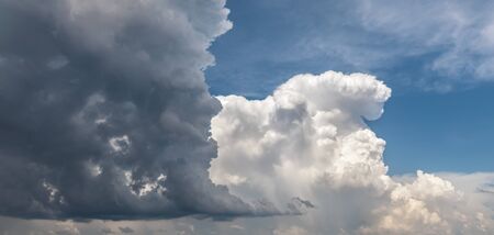 Natural background. Big and fluffy cumulonimbus cloud in the blue sky
