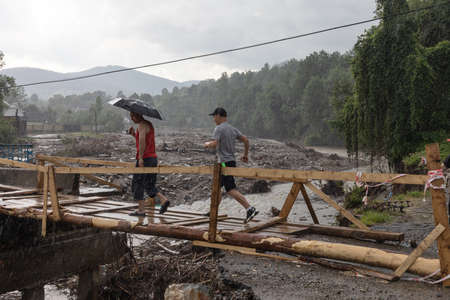 Carpathian reg. Ukraine - 28 Jun. 2020: Catastrophic flood in the western regions of Ukraine. Destroyed bridgeのeditorial素材
