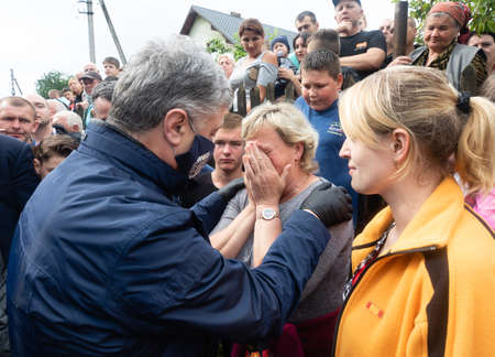 Carpathian reg. Ukraine - 28 Jun. 2020: Catastrophic flood in the western regions of Ukraine. Fifth president of Ukraine Petro Poroshenko speaks with flood victimsのeditorial素材