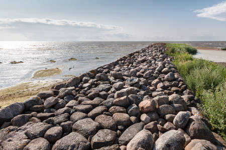 View of ancient cobble stone pier in Ainazi, Latvia. Rocky Ainazi pier in the Baltic Sea dividing Latvia and Estoniaの写真素材