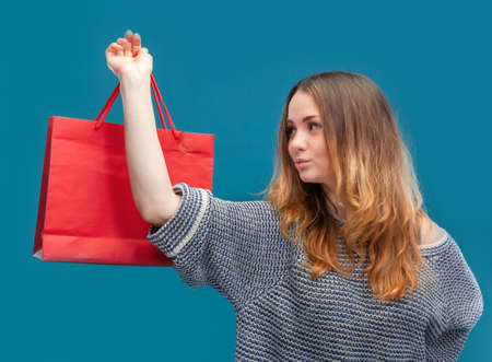 Young pretty girl with shopping bags. Image with copy space for your text or advertisement
