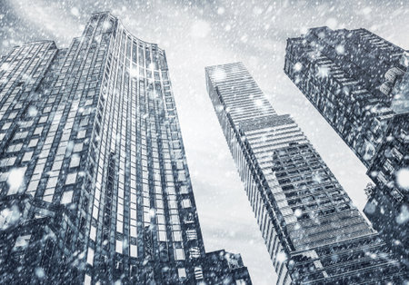 Winter in New York City. Falling snow in NYC. Winter Manhattan in the snowfallの写真素材