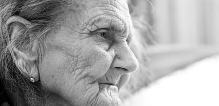 Old woman. Portrait of very old tired woman in depression. Black and white imageの写真素材