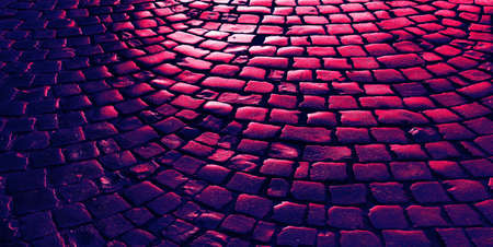 Streets of the old town. Stone paving texture. Abstract structured background. Image in trendy neon colorsの写真素材