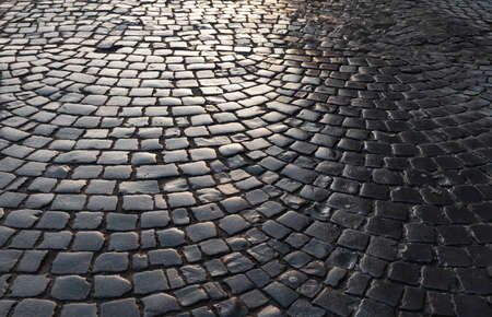 Streets of the old town. Stone paving texture. Abstract structured background.