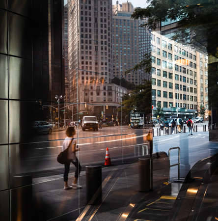 NEW YORK, USA - Sep 16, 2017: Manhattan street scene. The Americans on the streets of New York City. Abstract image of lights, shadows and reflections on the streets of NYCのeditorial素材