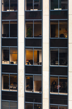 NEW YORK CITY, USA - Sep. 21, 2017: Facade of a multi-storey office building in Manhattan with many...