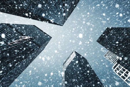 Winter in New York City. Falling snow in NYC. Winter Manhattan in the snowfallの写真素材