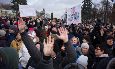 KYIV, UKRAINE - Nov. 24, 2021: Several hundred people protest against coronavirus restrictions and mandatory vaccinations. Text - Stop the global fascist dictatorshipのeditorial素材